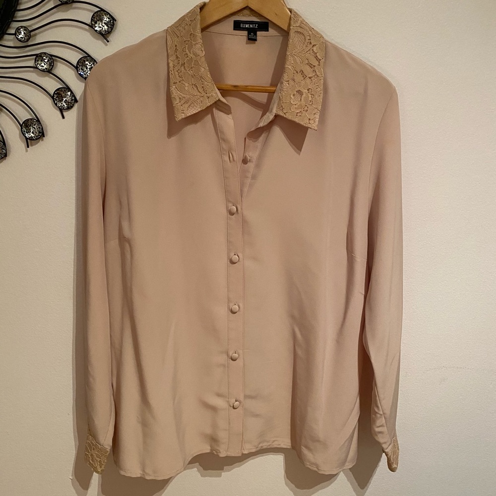 tan blouse.